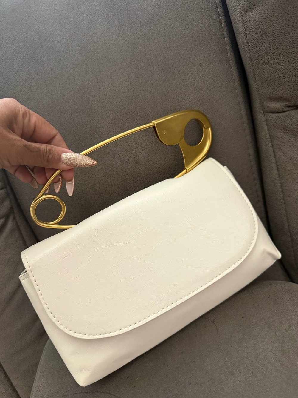 Elegant White Handbag with Gold Safety-Pin Handle